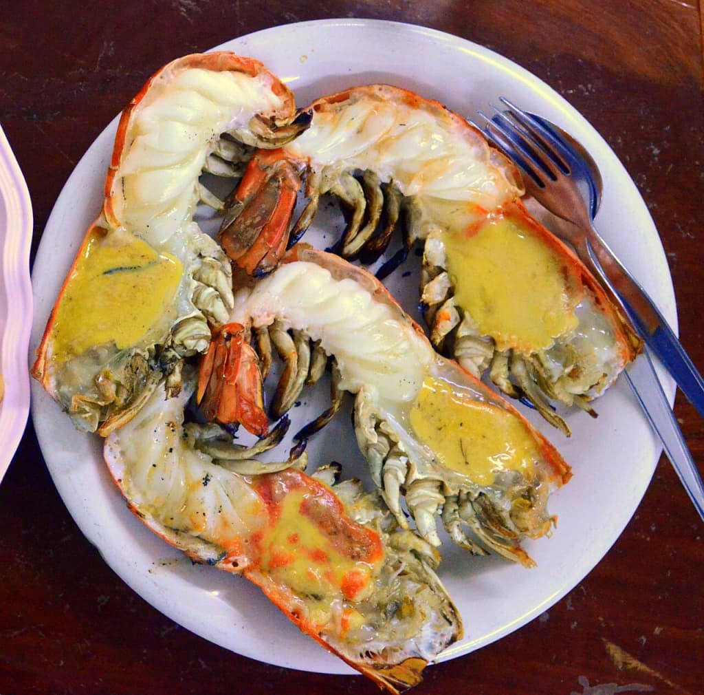 A plate of grilled giant river prawns.